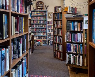 Isles of bookshelves off the entrance of Bad Rock Books